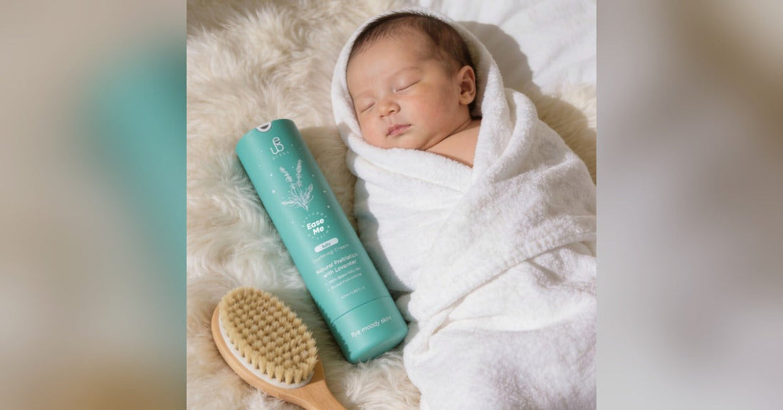 BEEUL Ease Me Baby Soothing Cream next to sleeping baby wrapped in towel